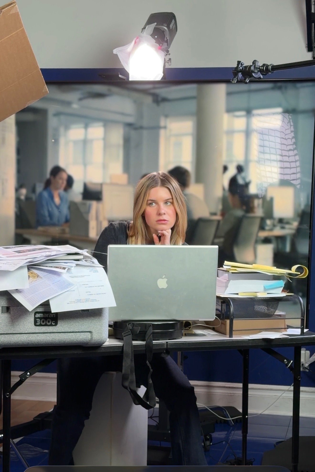 On set — actress at desk